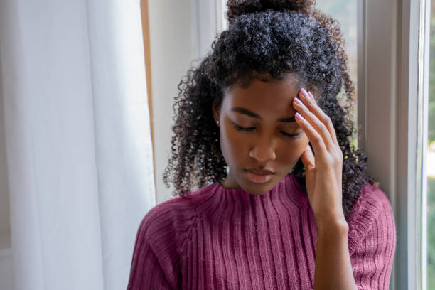 Portrait of sad young black woman feeling bad